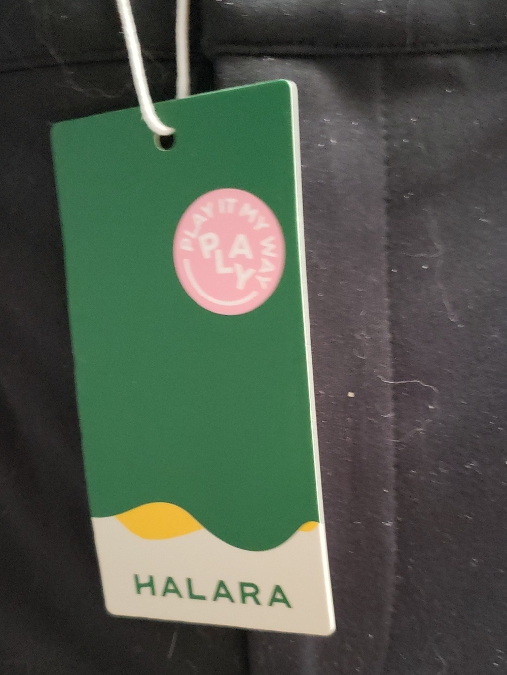 HALARA Green Tag with Pink Logo and Yellow Accent. Black Pants With Pockets. PL